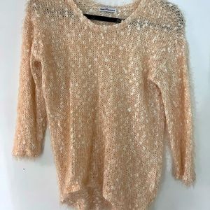 Quarter sleeve fuzzy sweater. Semi cropped